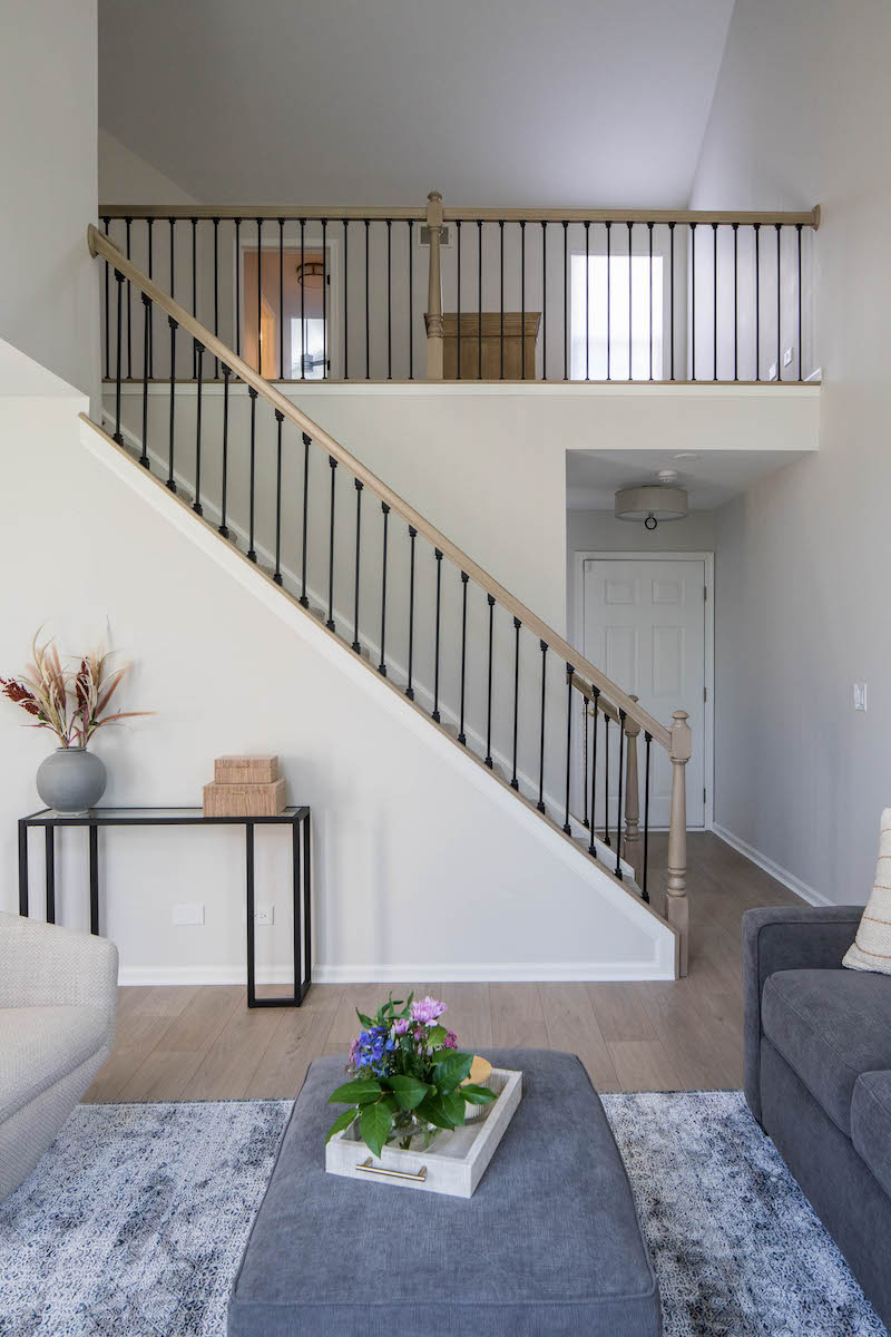 Townhouse stairway leading up to a mezzanine