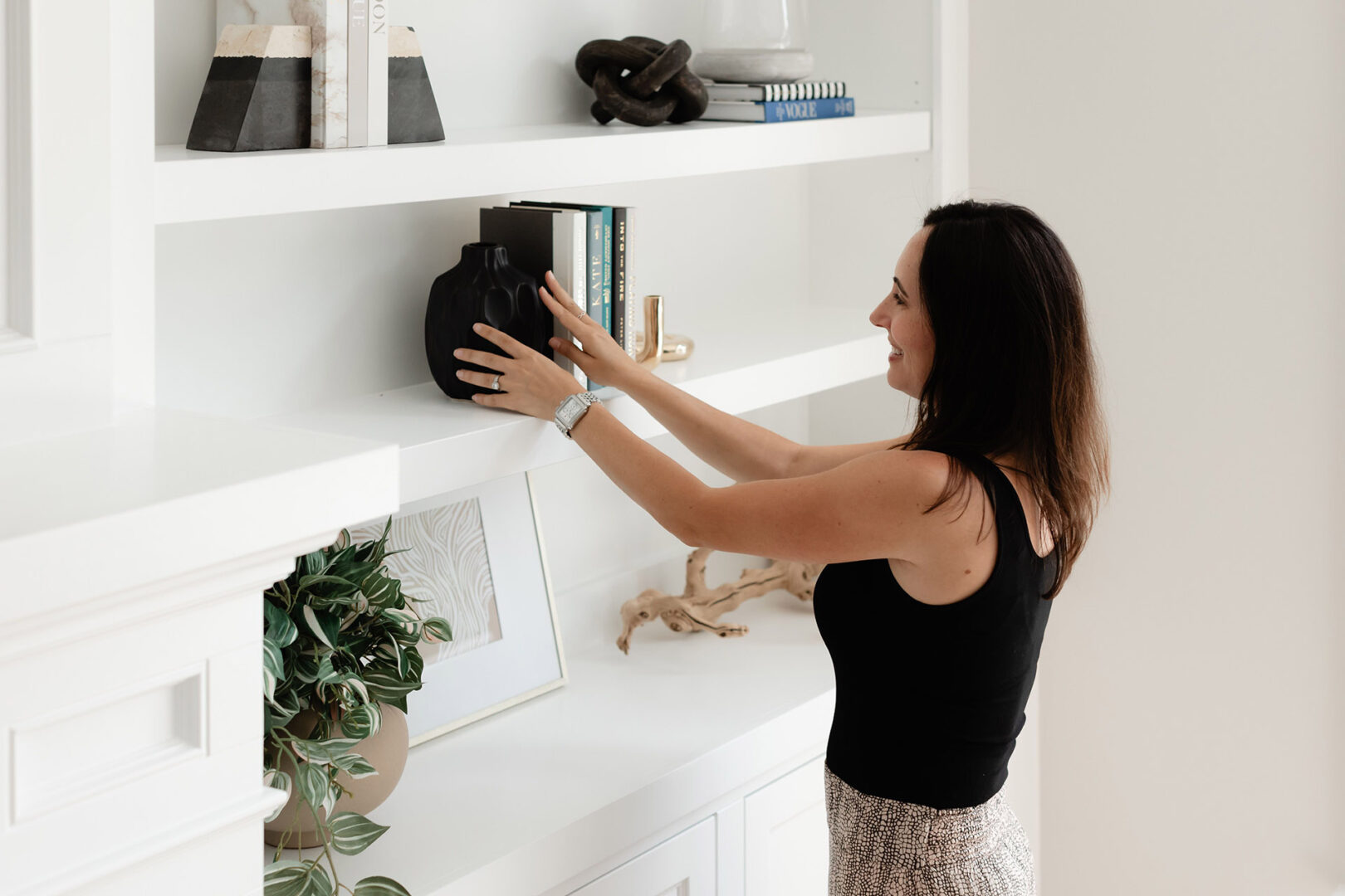 Photo of a Woman Holding Vase