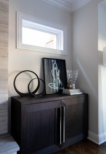 Corner nook with a dark wood cabinet and decorative objects
