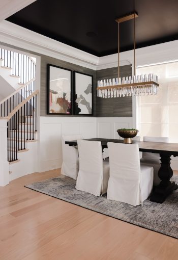 Dining room with dark wood dining table and fabric chairs