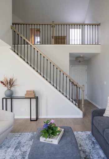 Townhouse stairway leading up to a mezzanine